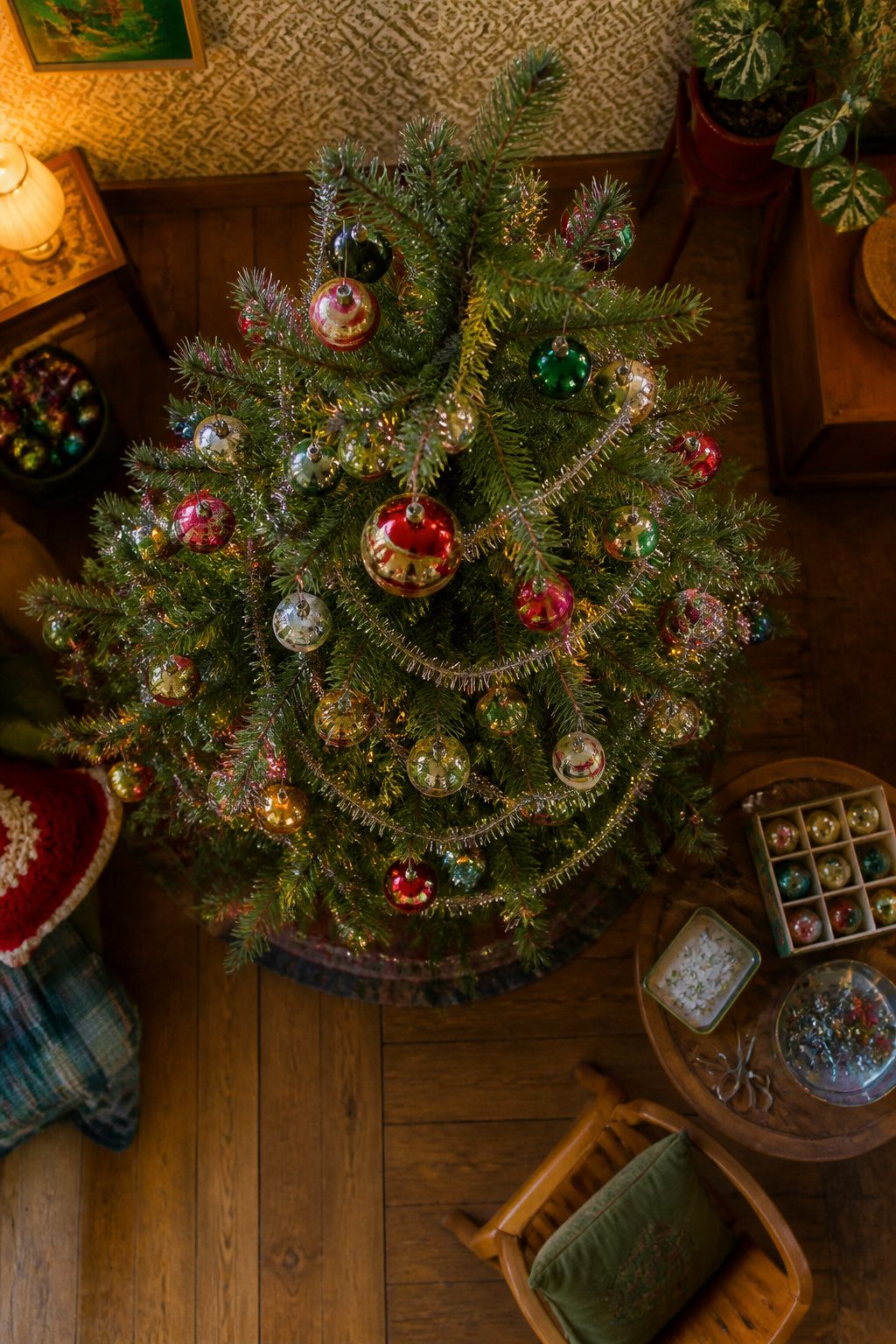 Traditional Christmas tree decorated with tinsel and glass ornaments.