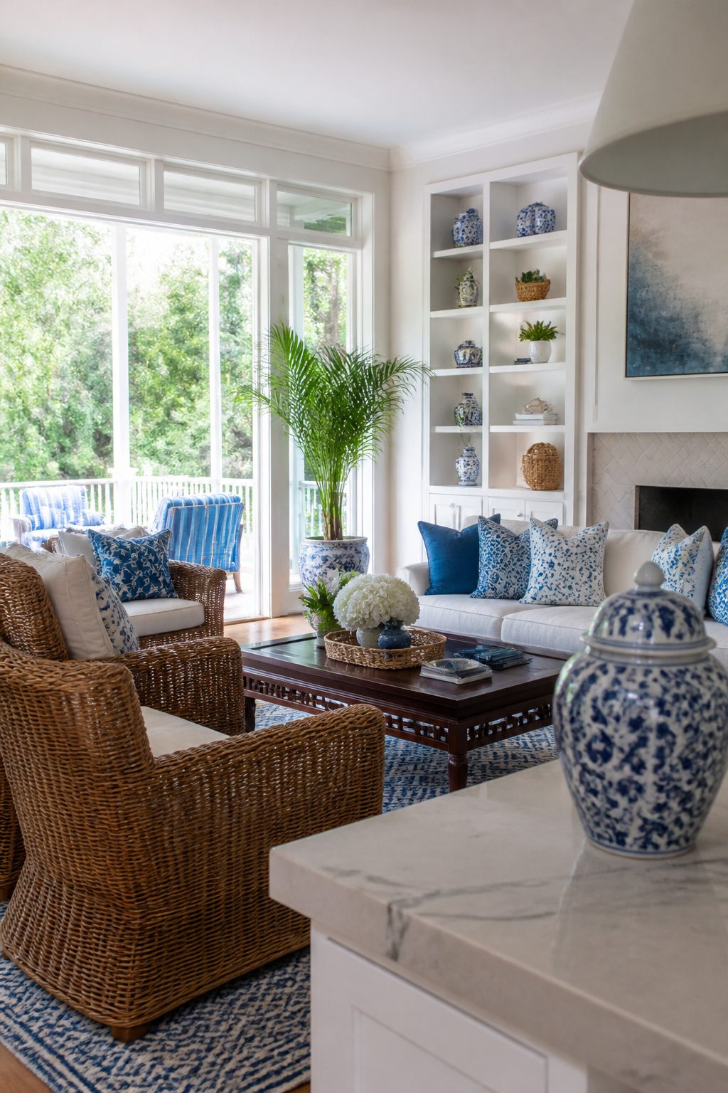 10 Summer Home Decor Inspiration Ideas for Easy Warm-Weather Style 2 Oversized wicker armchairs and blue-and-white decor in a cozy living room.