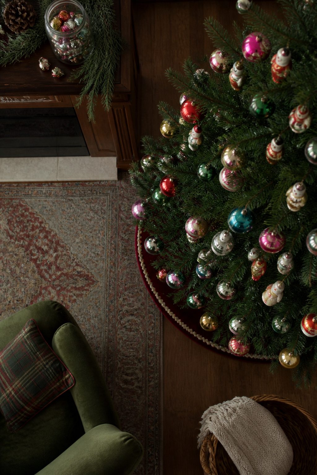 A collection of vintage ornaments hanging on a Christmas tree.
